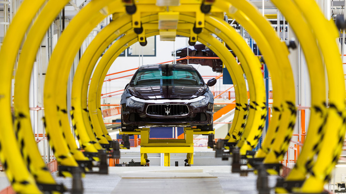 digitise image 3 Maserati Ghibli luxury cars move along the semi-automated production line at Fiat SpA’s Grugliasco ‘digital’ factory in Turin, Italy
