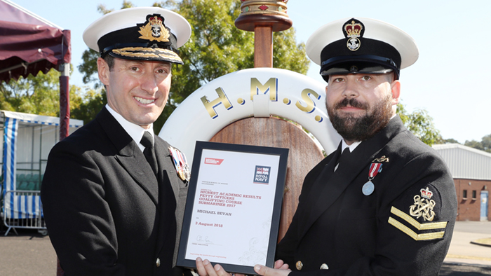 PO Michael Bevan receiving award from Rear Admiral Paul Methven 
