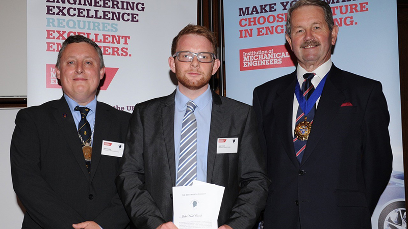 Jake Cronk (centre) receiving his award