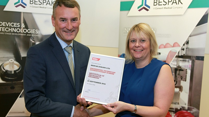 President Jon Hilton presents the certificate of accreditation to Teresa Gibson President Jon Hilton presents the certificate of accreditation to Teresa Gibson