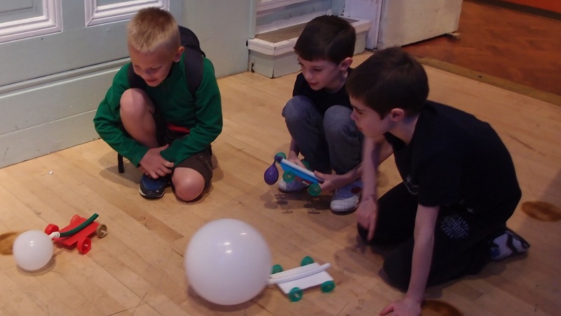 Schoolchildren race their balloon cars