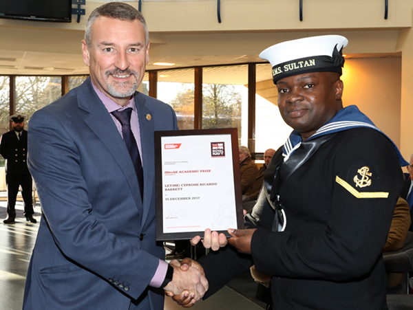 Jon Hilton presents Leading Hand LET (ME) Cyprone Ricardo Barrett with his award