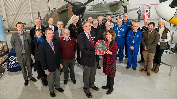 John Wood presents the Award to Maggie Appleton, CEO, RAF Museum