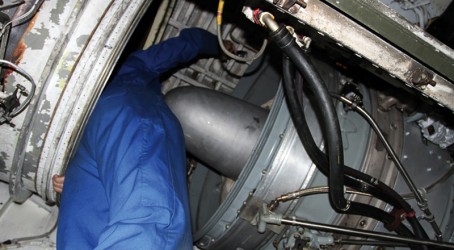 A repair worker conducts wiring checks Article image